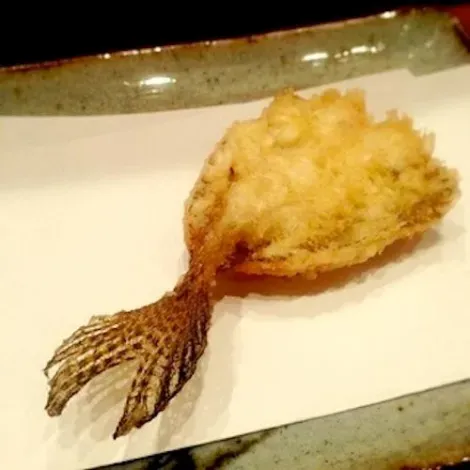 Each is delicately tempura filed on paper, freeing the last oil envelopes that surround it.