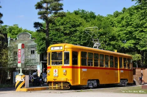 A tram travels the 1950s architectural Edo-Tokyo Garden, inviting back in time.