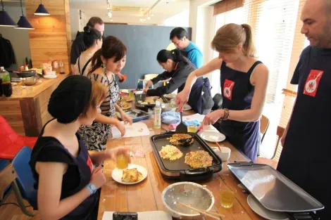 Making okonomiyaki with Cooking Tsukiji (Tokyo).